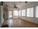 Bright and spacious sunroom with tile floors, ceiling fan, and white walls at 100 Cottonwood Pl, Stockbridge, GA 30281