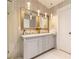 Bathroom featuring a large double vanity with modern fixtures and lighting at 1605 Signal Flag Way, Lawrenceville, GA 30043