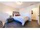 Comfortable bedroom with a cozy bed, bedside table, and hardwood floors at 1605 Signal Flag Way, Lawrenceville, GA 30043