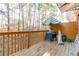 Wooden deck overlooking a private backyard with mature trees and lush greenery at 1605 Signal Flag Way, Lawrenceville, GA 30043