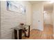 View of the entryway with hard wood floors, white walls, a small foyer table, and white doors at 1605 Signal Flag Way, Lawrenceville, GA 30043