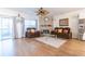 Open-concept living room with hardwood floors, large windows, and comfortable seating at 1605 Signal Flag Way, Lawrenceville, GA 30043