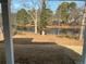 Waterfront view from a well lit back porch with columns at 3900 Arbor Se Ln, Conyers, GA 30094