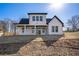 New construction home featuring a backyard, new sod, and black trim windows at 3900 Arbor Se Ln, Conyers, GA 30094