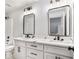 Modern bathroom with double vanity, white cabinets, marble countertop, and black fixtures at 3900 Arbor Se Ln, Conyers, GA 30094