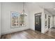 Charming dining room features a modern light fixture and bright windows at 3900 Arbor Se Ln, Conyers, GA 30094