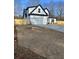 Charming white two-story home featuring a black roof, attached garage and a freshly seeded lawn at 3900 Arbor Se Ln, Conyers, GA 30094