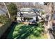 An aerial view of the backyard shows a grassy area and nice patio at 113 Kathryn Ave, Decatur, GA 30030