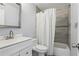 Inviting bathroom featuring a modern vanity with shower-tub and toilet at 1403 Parkaire Xing, Marietta, GA 30068