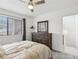 Comfortable bedroom with carpet, dresser, and natural light from the window at 1403 Parkaire Xing, Marietta, GA 30068