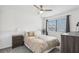 Bright bedroom featuring carpet, a ceiling fan, and a large window at 1403 Parkaire Xing, Marietta, GA 30068