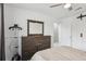 Serene bedroom with modern dresser, adjacent closet and neutral decor at 1403 Parkaire Xing, Marietta, GA 30068