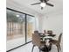 Cozy dining area with sliding doors to the fenced patio area and a contemporary table at 1403 Parkaire Xing, Marietta, GA 30068