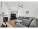 Spacious living room featuring vaulted ceilings, a cozy fireplace, and plush gray sectional sofa at 1403 Parkaire Xing, Marietta, GA 30068