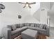 Cozy living area featuring a large gray sectional sofa, high ceilings, and natural light at 1403 Parkaire Xing, Marietta, GA 30068