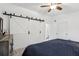 Spacious main bedroom featuring sliding barn door closet and neutral decor at 1403 Parkaire Xing, Marietta, GA 30068