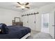 Comfortable main bedroom with ceiling fan, gray carpet, and adjacent ensuite at 1403 Parkaire Xing, Marietta, GA 30068