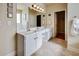 Bathroom features double sinks, a large mirror, and an abundance of storage space at 3710 Blackgold Dr, Buford, GA 30519