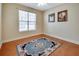 Bedroom with a classic ceiling fan, neutral walls, and a plush area rug on the floor at 3710 Blackgold Dr, Buford, GA 30519