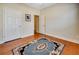 Bedroom with gleaming hardwood floors and a classic area rug at 3710 Blackgold Dr, Buford, GA 30519