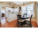 Charming breakfast area with white trim, light fixture, and views into the kitchen at 3710 Blackgold Dr, Buford, GA 30519