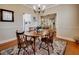 Traditional dining room showcasing a wooden table and built-in shelving in the background at 3710 Blackgold Dr, Buford, GA 30519