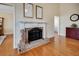 Traditional brick fireplace with white mantel, adding warmth and character to the home at 3710 Blackgold Dr, Buford, GA 30519