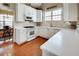 Well-lit kitchen featuring white cabinetry, quartz countertops, and stainless steel appliances at 3710 Blackgold Dr, Buford, GA 30519