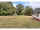 Large backyard with shed and mature trees at 4280 Atlanta St, Powder Springs, GA 30127