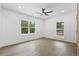 Bright bedroom with ceiling fan and hardwood floors at 4280 Atlanta St, Powder Springs, GA 30127