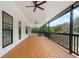 Long front porch with wooden flooring and black railings at 4280 Atlanta St, Powder Springs, GA 30127