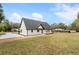 White house exterior with black trim, large backyard at 4280 Atlanta St, Powder Springs, GA 30127