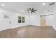 Living room with LVP flooring, barn door, and view of kitchen at 4280 Atlanta St, Powder Springs, GA 30127