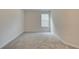 Bright bedroom with neutral walls and carpeting at 4351 Portsbrook Ave, Snellville, GA 30039