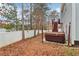 Backyard features a hot tub on a concrete pad and a white fence at 612 Cole Creek Dr, Dallas, GA 30157