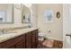 Well-lit bathroom with granite counters, dual sinks, and modern fixtures at 612 Cole Creek Dr, Dallas, GA 30157