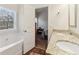 Bright bathroom with a tub and shower combination and granite countertop on the sink vanity at 612 Cole Creek Dr, Dallas, GA 30157