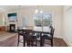 Cozy dining area with seating for four adjacent to the living room at 612 Cole Creek Dr, Dallas, GA 30157