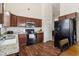 Functional kitchen with stainless steel appliances and granite countertops adjacent to the dinning area at 612 Cole Creek Dr, Dallas, GA 30157