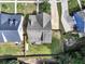 Aerial view of a gray roof home with well-manicured lawn, fence, and trees at 275 Creek View Ln, Acworth, GA 30102