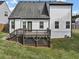 View of the back exterior of a two-story home with a deck and gray roof at 275 Creek View Ln, Acworth, GA 30102