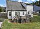 Back exterior of the two-story house with a wooden deck and backyard at 275 Creek View Ln, Acworth, GA 30102