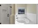 Bright bathroom showcasing a soaking tub, white subway tile, and a glass-enclosed shower at 275 Creek View Ln, Acworth, GA 30102