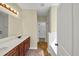 Bathroom featuring dual vanities and tub-shower combo with white subway tile at 275 Creek View Ln, Acworth, GA 30102