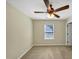 Bedroom with neutral walls, carpet, ceiling fan, and a window with blinds at 275 Creek View Ln, Acworth, GA 30102