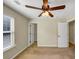 Bedroom with ceiling fan, neutral walls, carpet, and closet, illuminated by window light at 275 Creek View Ln, Acworth, GA 30102