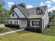 View of the home's exterior showcasing well-maintained lawn and landscaping at 275 Creek View Ln, Acworth, GA 30102