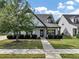 Charming two-story home with a manicured front yard, lush lawn, and welcoming walkway at 275 Creek View Ln, Acworth, GA 30102