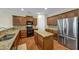 Well-equipped kitchen featuring stainless steel appliances, an island, and granite countertops at 275 Creek View Ln, Acworth, GA 30102