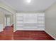 Living area with hardwood floors, built-in bookshelves and a view to other rooms at 275 Creek View Ln, Acworth, GA 30102